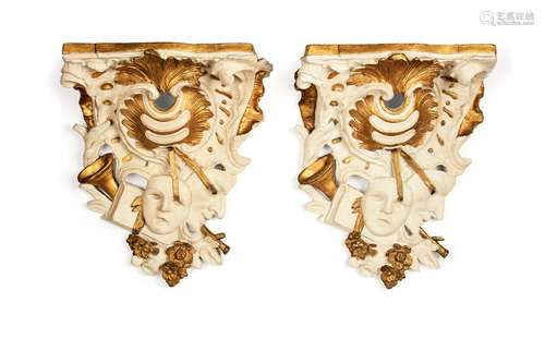 A pair of painted plaster wall brackets in George III style