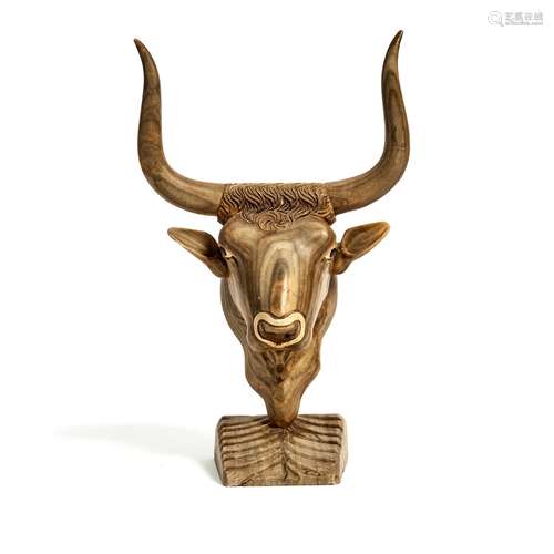 A Continental carved alabaster model of a bull's head in Minoan style