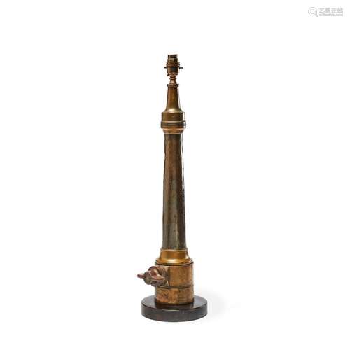 A brass firehose nozzle by John Morris & Sons refitted as a table lamp