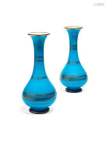 A pair of glass sky-blue vases