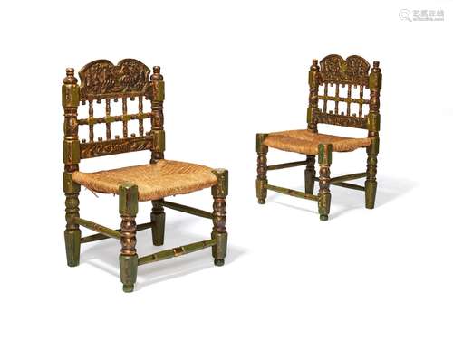 A pair of Spanish green painted and parcel giltwood side chairs