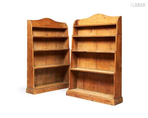 A pair of Regency pine 'waterfall' open bookcases
