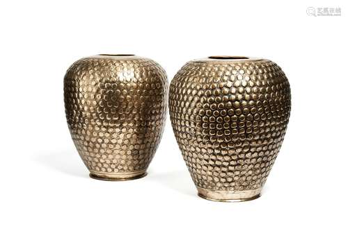 A pair of Indian silvered brass repoussé vases