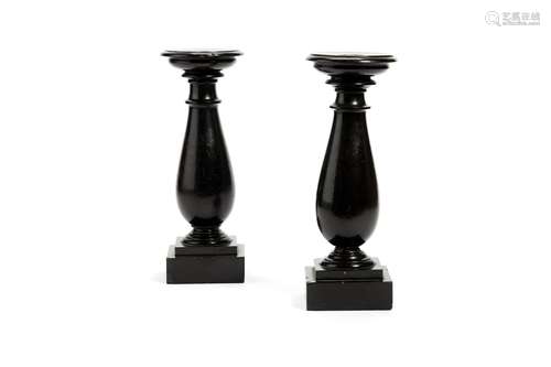 A pair of Victorian slate or Derbyshire Black Ashford marble turned candle holders