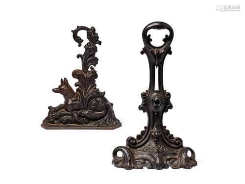 A Victorian cast iron door stop in Rococo Revival taste