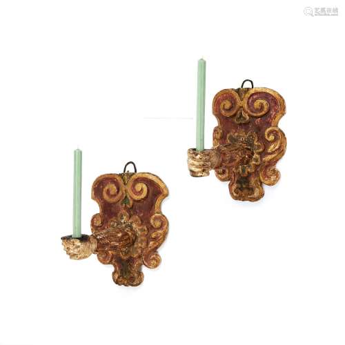 A pair of Italian carved, painted and giltwood wall sconces