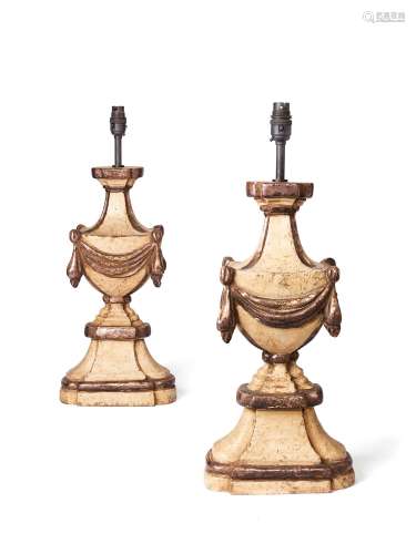 A pair of silvered and cream painted wood urn table lamps