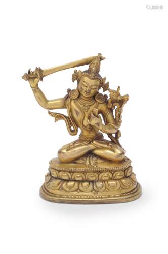 A Sino-Tibetan gilt-bronze figure of Manjushri
