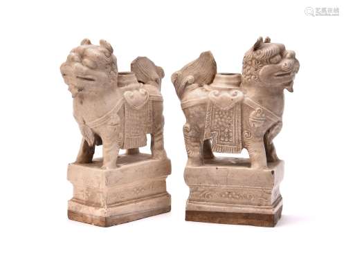 A pair of Chinese white glazed candle holders