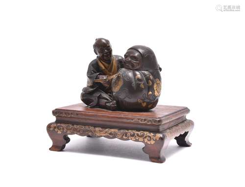 Miya-O Eisuke: A Parcel Gilt Bronze Group of a seated sculptor