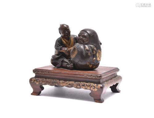 Miya-O Eisuke: A Parcel Gilt Bronze Group of a seated sculptor