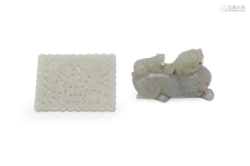 A Chinese celadon jade carving of a mythical beast and cub