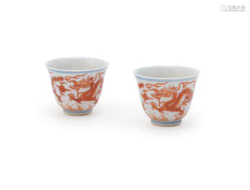 A pair of iron-red 'Dragon' wine cups