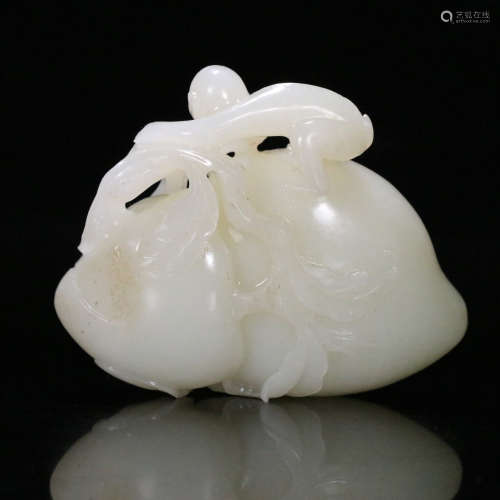 A Chinese Hetian Jade Carved Monkey and Peach Ornament