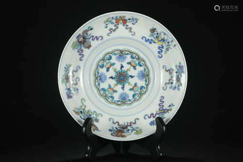 AN OVERGLAZED PLATE WITH FLOWER PATTERNS