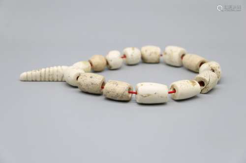 Hongshan Culture  huangyuji bone, white shell, silkworm pupa, string of beads