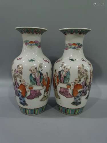 A pair of Guanyin bottles decorated with famille rose