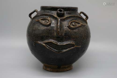 Xixia  celadon double series jar with human face pattern