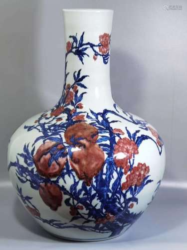 Blue and white vase with red pomegranate pattern