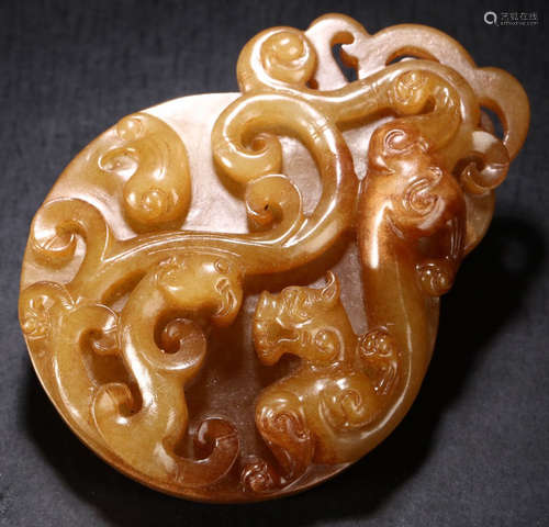 A HETIAN JADE CARVED DRAGON PATTERN BI