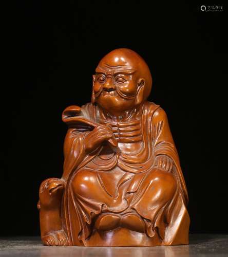 HUANYANG BOXWOOD CARVED 'ARHAT' SEATED FIGURE