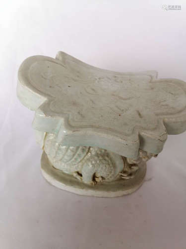 CELADON GLAZED 'MYTHICAL BEAST' PORCELAIN PILLOW REST