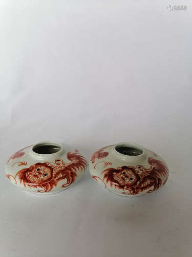 PAIR OF UNDERGLAZED RED 'LIONS' SMALL JARS