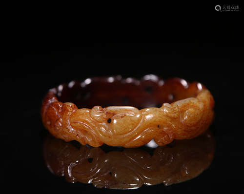 HETIAN JADE CARVED 'DRAGON AND PHOENIX' BANGLE