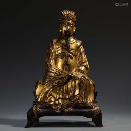 A CHINESE GILT BRONZE GOD OF WEALTH BUDDHA