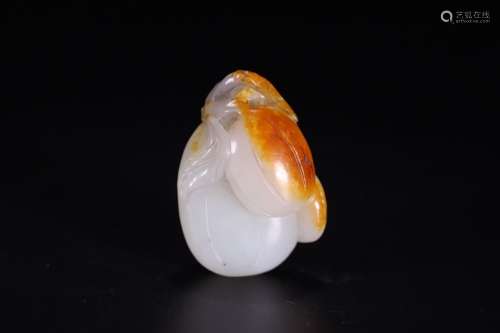 A CHINESE HETIAN JADE HANDPIECE WITH FRUIT CARVING