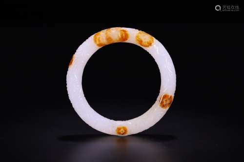 A CHINESE HETIAN JADE BANGLE WITH CLOUD PATTERN