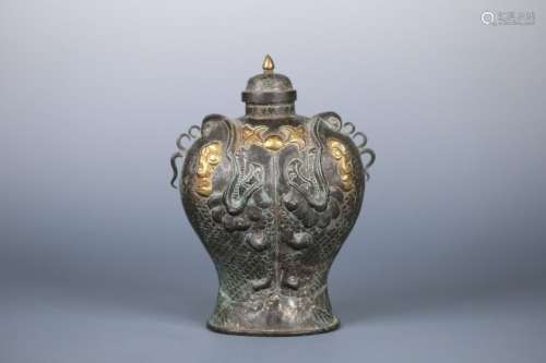 A CHINESE SILVER JAR WITH DRAGON CARVING