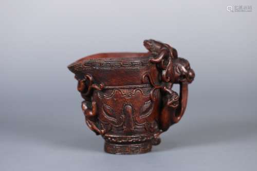 A CHINESE AGARWOOD VESSEL WITH DRAGON PATTERN