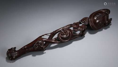 A CHINESE ROSEWOOD RUYI WITH GANODERMA PATTERN