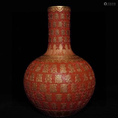 A CHINESE RED GLAZE BOTTLE VASE WITH LONGEVOUS PATTERN