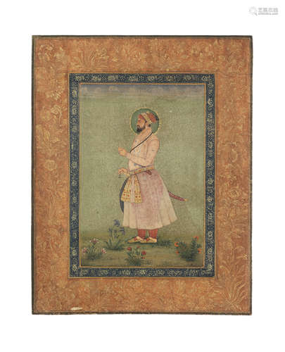 A Mughal Emperor standing in a landscape, holding a flower Mughal, late 18th Century