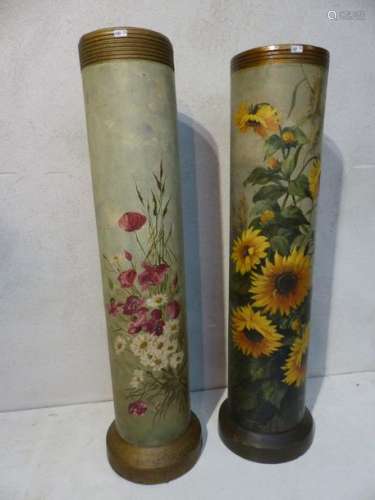 2 terracotta pipes painted with flowers and birds.