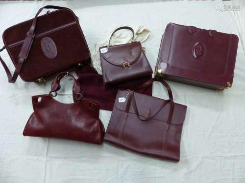 3 suitcases and 2 handbags. All Cartier brand and …