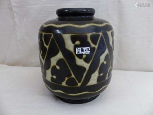 Spherical earthenware vase with stylized floral de…
