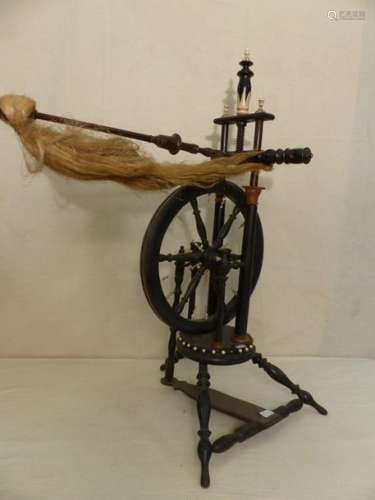 Wooden and ivory spinning wheel.
