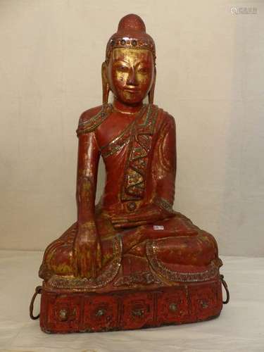 A sitting Buddha in red and gold lacquered wood an…