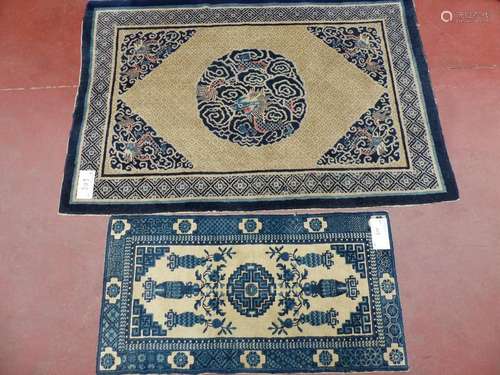 Two Chinese rugs with dragon decoration and flower…