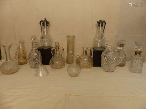 A set of 12 glass crystal decanters, pourers or va…