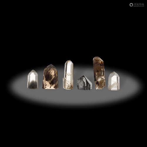 Seven Polished Crystal Points with Phantoms