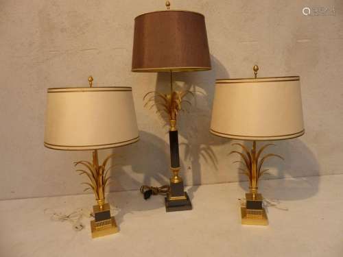 Pair of gilded metal lamps with palm tree decorati…