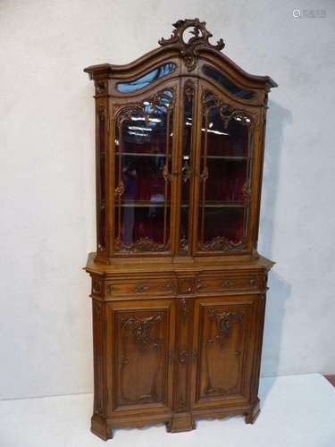 Small two body carved oak display case in the Rege…