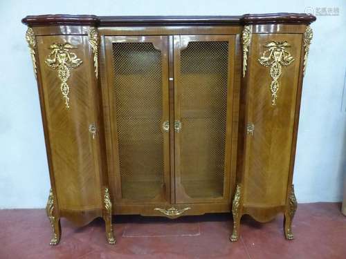 Bookcase 4 doors in veneer and gilt bronze. Period…