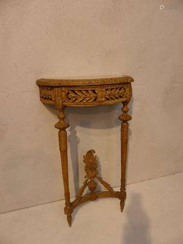 Small carved wooden half moon console in the Louis…