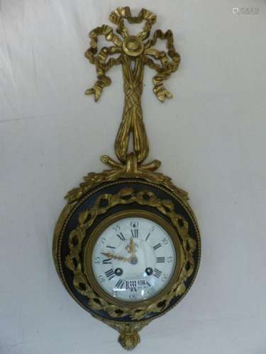 Small Louis XVI style wall clock in gilt bronze an…
