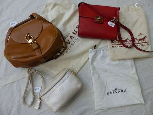 3 small leather Delvaux bags.